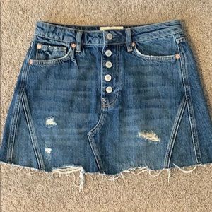 Distressed jean skirt.